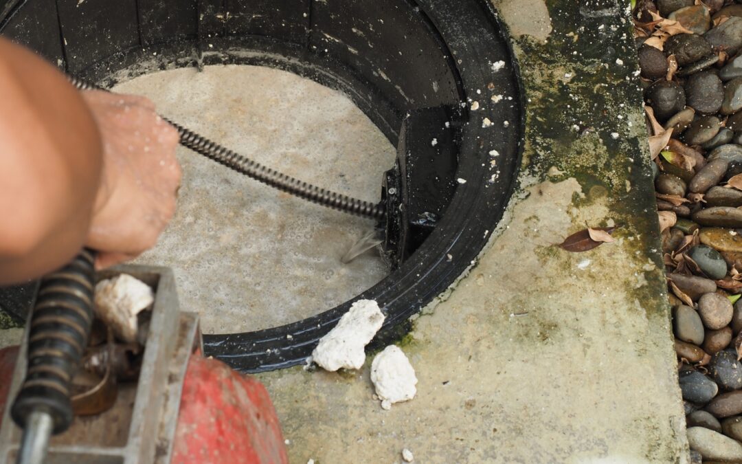 Plumbing Services Cleaning Out A Commercial Grease Trap Line